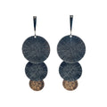 Pair of layered circular earrings on a white card with a blue border.