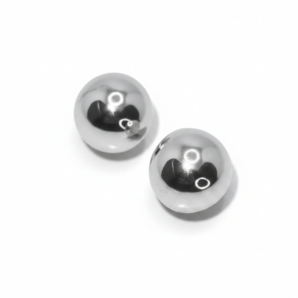 Pair of silver earrings on a white background