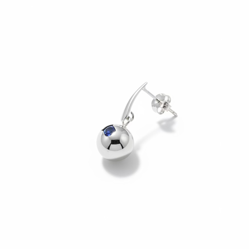 These sweet drop earrings ending in a sphere of silver, making
a high-light piece, with a strong simple statement. Total class.