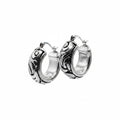 Pair of silver hoop earrings on a white background